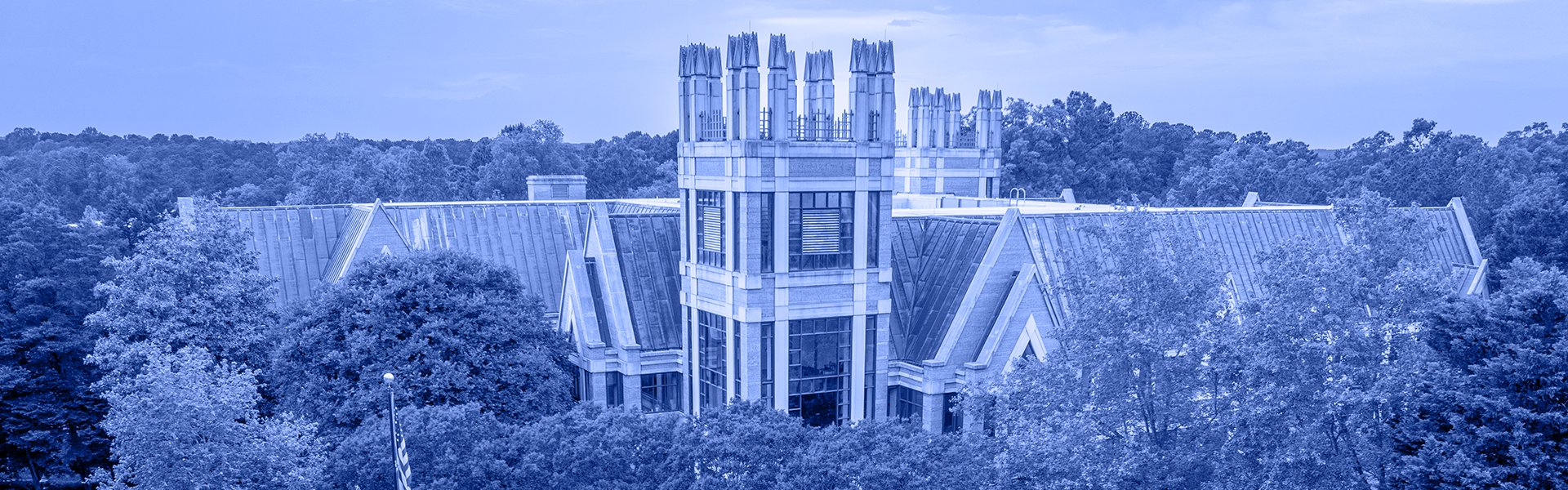 Aerial view of a building surrounded by trees